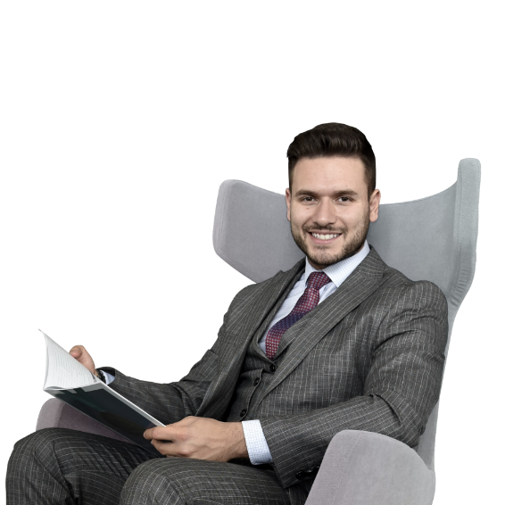 Businessman sitting on a sofa holding a brochure